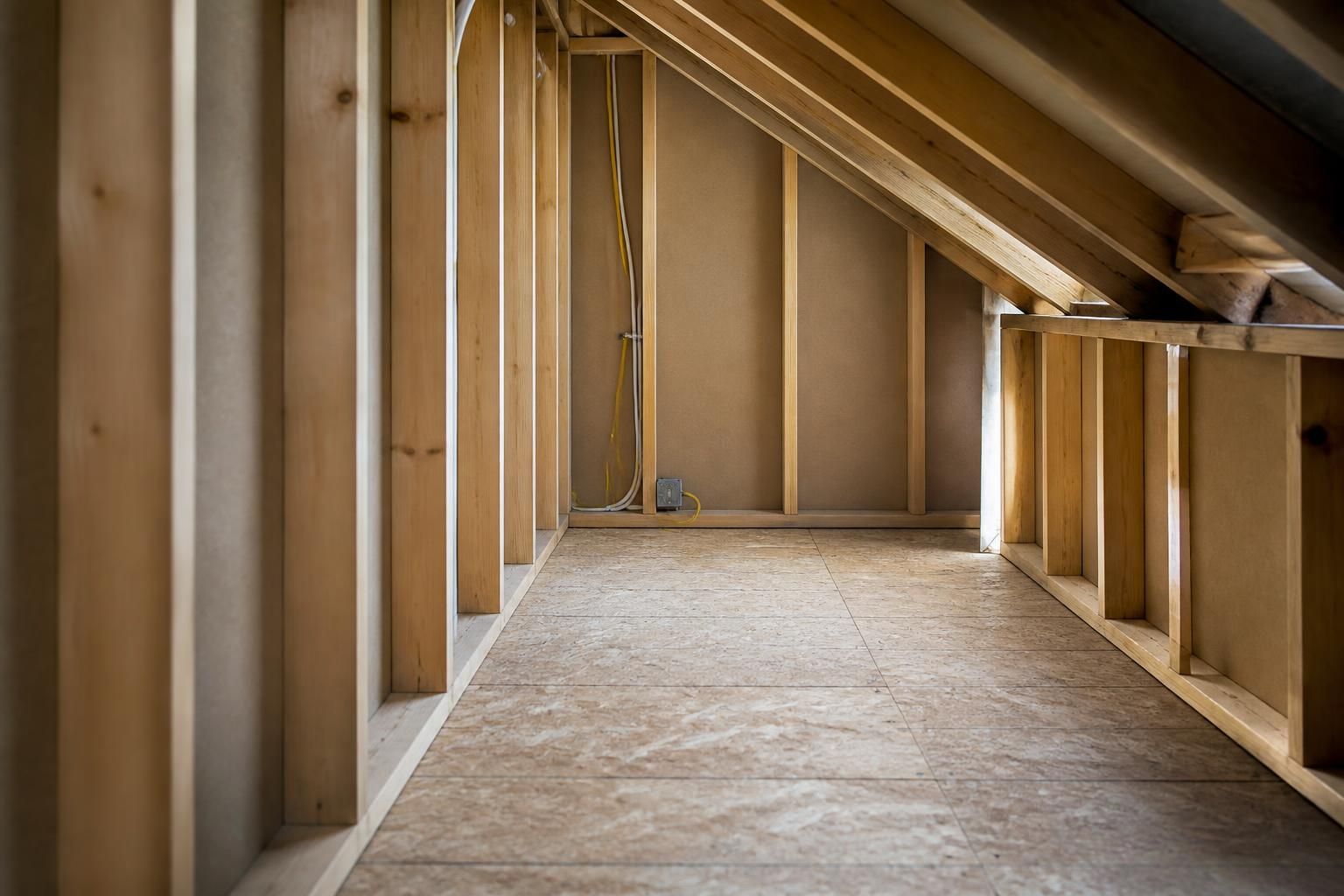Prepared attic space after old insulation removal.